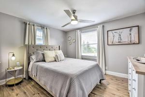 a bedroom with a bed and a ceiling fan at Orchard Park Home Less Than 2 Mi to Highmark Stadium! in Orchard Park