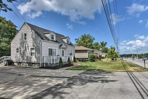a house on the side of the road at Orchard Park Home Less Than 2 Mi to Highmark Stadium! in Orchard Park