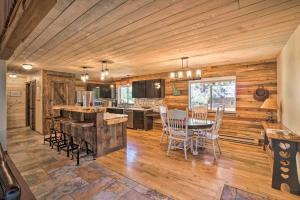 a kitchen and dining room with a table and chairs at Beautiful McCall Cabin Perfect for Families! in McCall