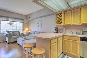 a kitchen and living room with a couch at Quaint Wildwood Condo about Walk to Beach! in Wildwood