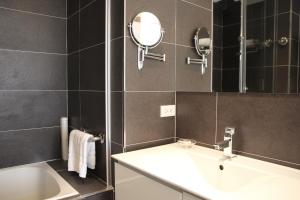 Koupelna v ubytování Capital Hotel SongShan