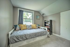 a bedroom with a bed and a window at Lakeside Retreat with Office and Stunning Views! in Portage