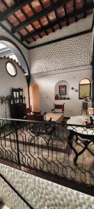 a living room with chairs and tables in a building at Casa de Oda in Salta