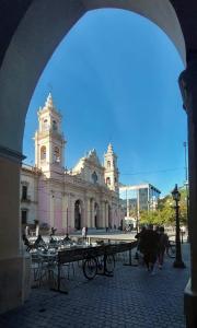 a large white building with a clock tower at Casa de Oda in Salta