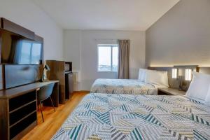Postel nebo postele na pokoji v ubytování Motel 6-Denison, TX