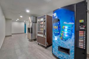 a room with two vending machines and a video game at Motel 6-Denison, TX in Denison