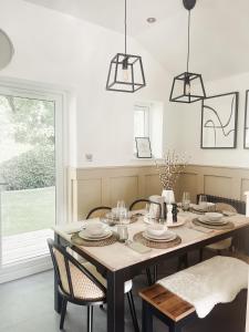 a dining room with a table and chairs at D abode Devon in Torquay