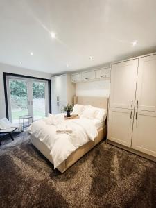 Ένα ή περισσότερα κρεβάτια σε δωμάτιο στο D abode Devon