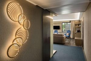 a hallway with a wall with lights on it at Radisson Blu Marina Palace Hotel, Turku in Turku