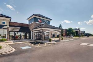 a front view of a china chicken restaurant with a parking lot at Best Western Chicago - Downers Grove in Downers Grove