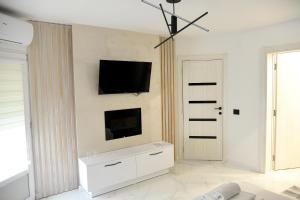 A television and/or entertainment centre at Pansion Eden