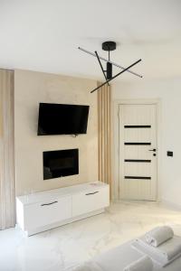 A television and/or entertainment centre at Pansion Eden