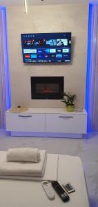 A television and/or entertainment centre at Pansion Eden