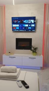 A television and/or entertainment centre at Pansion Eden