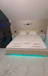 A bed or beds in a room at Pansion Eden