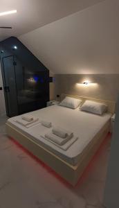 A bed or beds in a room at Pansion Eden