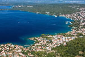 an aerial view of a city and the water at Apartments by the sea Malinska (Krk) - 5290 in Vantačići