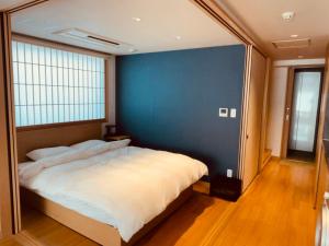 Voodi või voodid majutusasutuse Nplus Tokyo Akihabara Premium toas