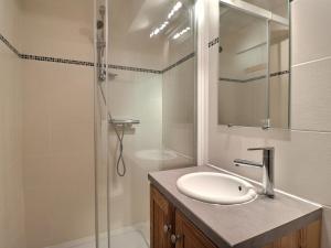 a bathroom with a sink and a shower at Appartement La Tania, 2 pièces, 6 personnes - FR-1-182A-4 in Courchevel
