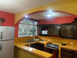 Η κουζίνα ή μικρή κουζίνα στο Casa 3 a 5 min del Irtra +5 φωτογραφίες