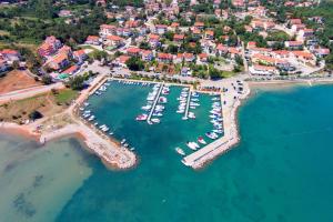 an aerial view of a harbor with boats in the water at Apartments with parking space Cizici, Krk - 15415 in Malinska