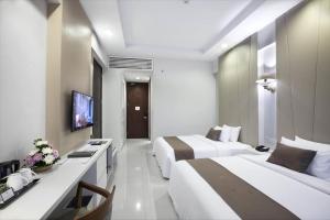 Telewizja i/lub zestaw kina domowego w obiekcie R Hotel Rancamaya