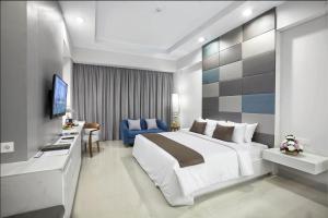 Łóżko lub łóżka w pokoju w obiekcie R Hotel Rancamaya