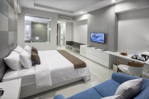 Łóżko lub łóżka w pokoju w obiekcie R Hotel Rancamaya