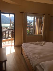 Katil atau katil-katil dalam bilik di Beli Guest House