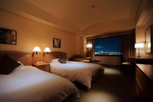 Postel nebo postele na pokoji v ubytování Royal Pines Hotel Urawa
