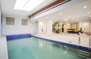 a swimming pool in a building with a swimming pool at KULA North Sydney-Napier in Sydney