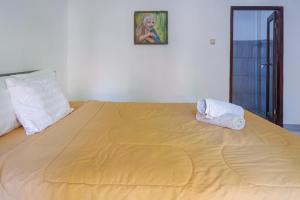 Ein Bett oder Betten in einem Zimmer der Unterkunft Bukit Garden Gili Trawangan