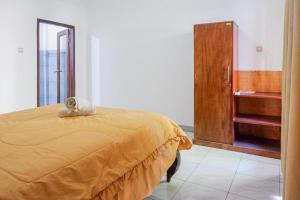 Ein Bett oder Betten in einem Zimmer der Unterkunft Bukit Garden Gili Trawangan