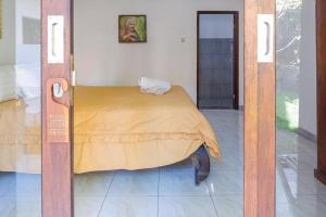 Ein Bett oder Betten in einem Zimmer der Unterkunft Bukit Garden Gili Trawangan