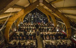 an overhead view of a dining hall with a christmas tree at Snow Resort Kirkenes in Kirkenes