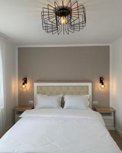 Ένα ή περισσότερα κρεβάτια σε δωμάτιο στο Chic Studio Maramures