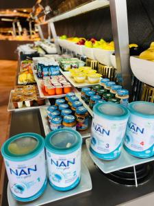 a bunch of canned food on a counter with drinks at HVD Reina del Mar - Premium Spa Service & Free Parking in Obzor