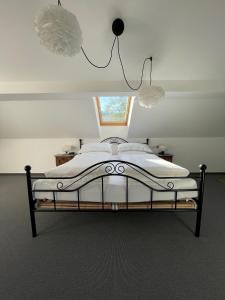 a bedroom with a large bed with a window at Ferien im Karlstal in Haigerloch