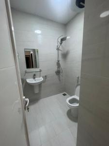 a bathroom with a toilet and a sink at RED-25 - Razat Alard 4 in Salalah