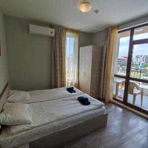 Ліжко або ліжка в номері Sorrento Sole Mare - Apartments by the beach