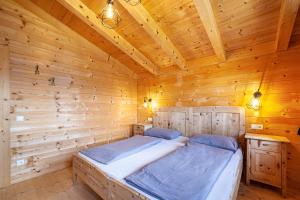 Posteľ alebo postele v izbe v ubytovaní Bergchalet Refugium Martius
