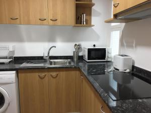Kuchyň nebo kuchyňský kout v ubytování Apartamento céntrico con 2 habitaciones y Wi-Fi + 4 fotografie