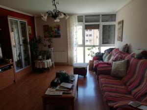 a living room with a couch and a coffee table at Piso el castillo in Medina de Pomar