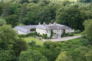 an aerial view of a house in the forest at Beaufort House in Beaufort