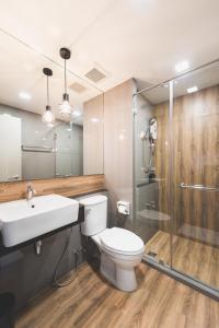 a bathroom with a toilet and a sink and a shower at W2 RESIDENCE in Ban Zong Katiam