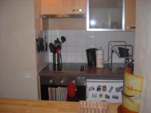 a kitchen with a stove and a counter top at Beautiful Old property in Bordeaux Center in Bordeaux