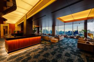 a living room filled with lots of furniture at Park Hotel Tokyo in Tokyo