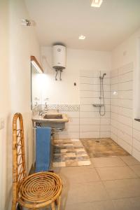 a bathroom with a sink and a shower at CASA DELEDDA in Budoni