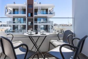a room with a table and chairs and a window at Olive 2-Bedroom Apartment in Larnaca in Larnaka