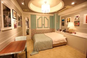Ένα ή περισσότερα κρεβάτια σε δωμάτιο στο Hotel OLDSWING Adult Only